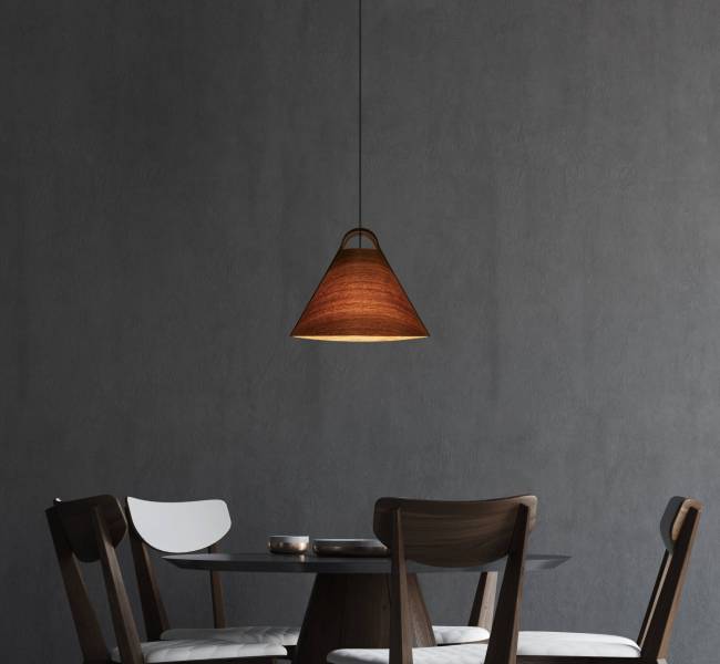 Minimalistic gray dining room interior with a round wooden and black table and four chairs. 3d rendering mock up